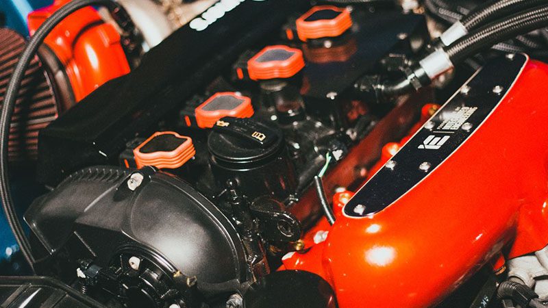 Close-up of a modern car engine, displaying advanced components and clean engine bay layout.