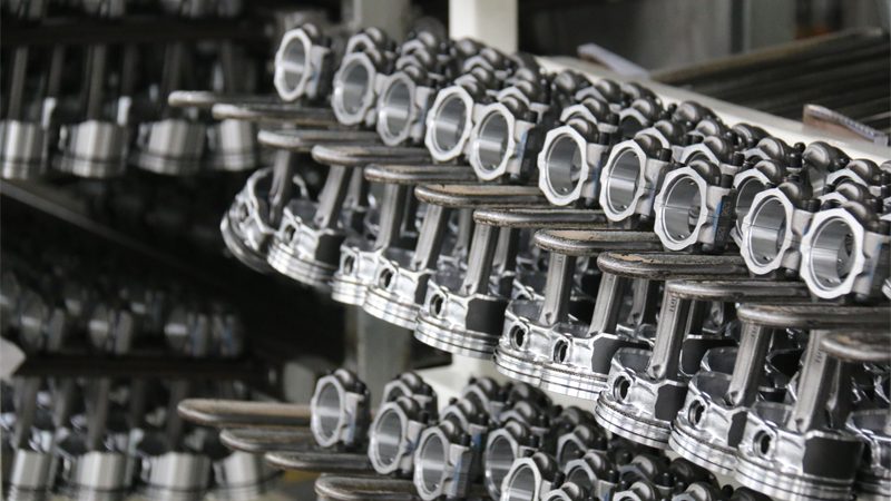 Close-up of high-quality auto engine parts showcased at Nanjing Woda Auto Technology Co., Ltd.'s factory, emphasizing precision and reliability.