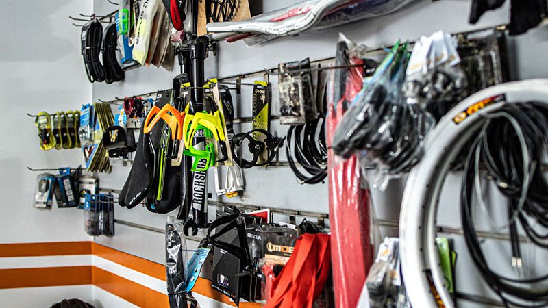 Auto parts displayed in their casing at a parts store, ready for purchase and installation.