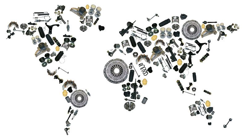 World map creatively formed with various auto parts, symbolizing global automotive supply