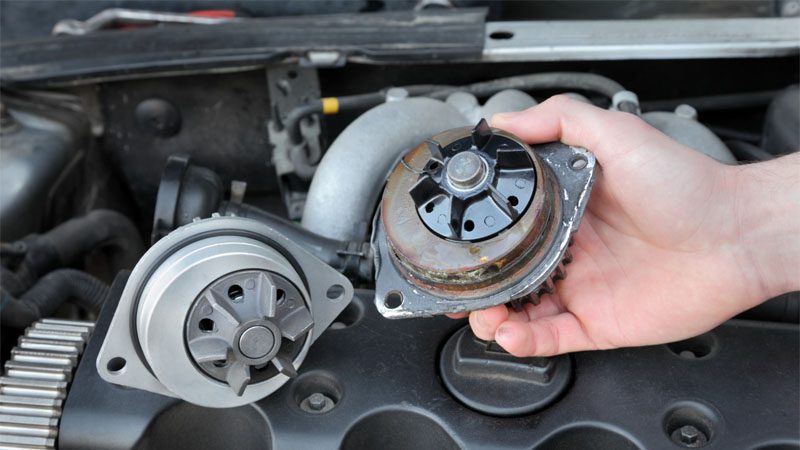 Detailed view of automotive water pump for engine temperature regulation.