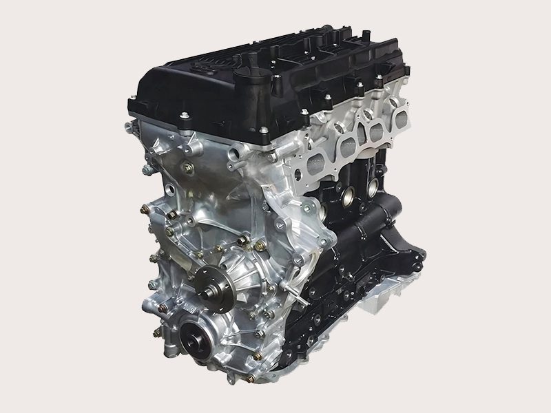 Toyota 2TR engine close-up, showing key components like the engine block and cylinder head.