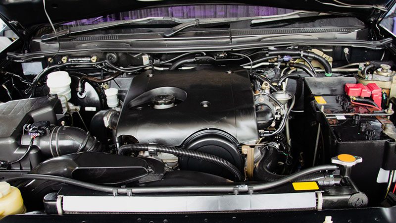 Close-up of a freshly tuned-up car engine looking clean and restored like new.