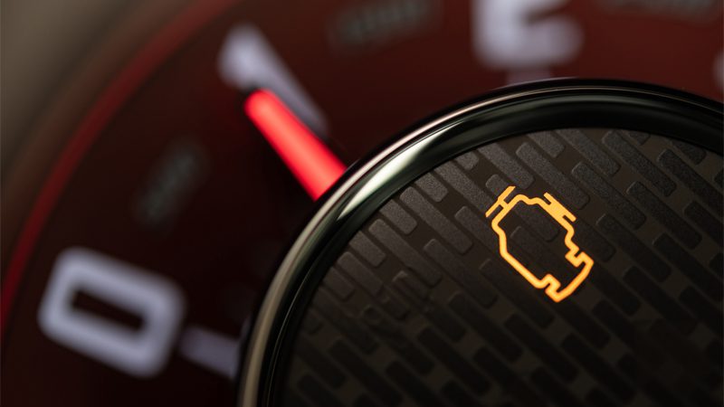 Flashing check engine light on the dashboard, indicating a possible P0300 random misfire issue.