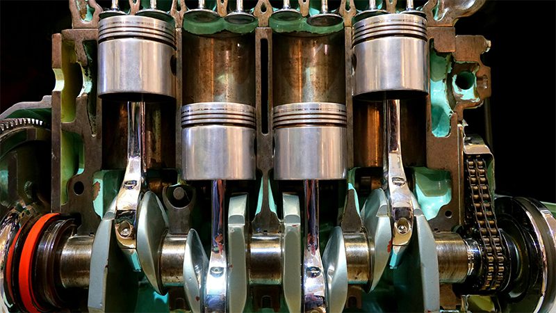 Close-up of engine components, including the crankshaft, pistons, and other key parts.