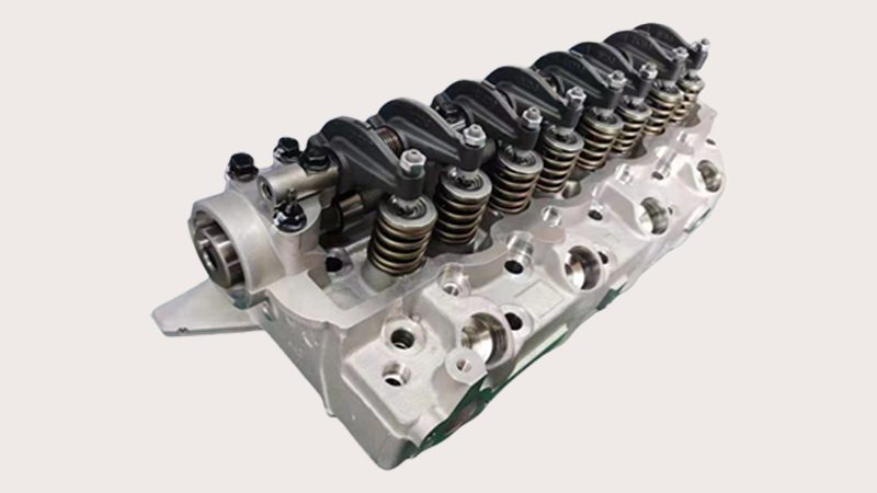 Close-up of a cylinder head with visible valve seats and ports, illustrating the precise location and arrangement of engine valves.