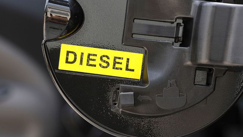 Close-up of the word 'Diesel' written on a vehicle's fuel door