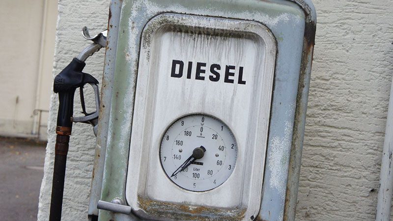 Close-up of a diesel fuel pump at a gas station, highlighting the availability of diesel fuel, as discussed in the blog about diesel engine longevity.