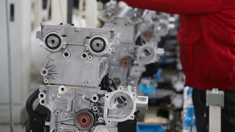 Downsized engines displayed on the production line at an automaker's factory, highlighting compact design and efficiency.