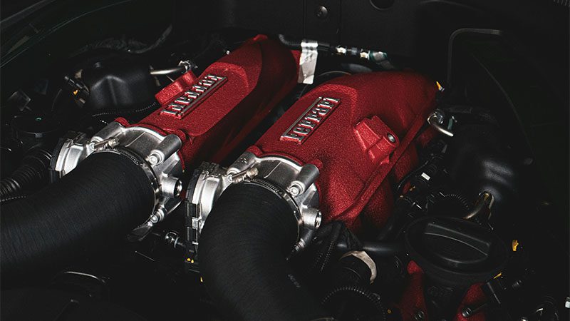 Close-up of an internal combustion engine, showcasing traditional design.