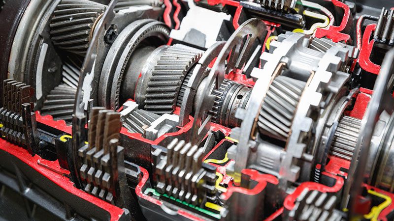 Cutaway view of an automatic car transmission showing internal components.