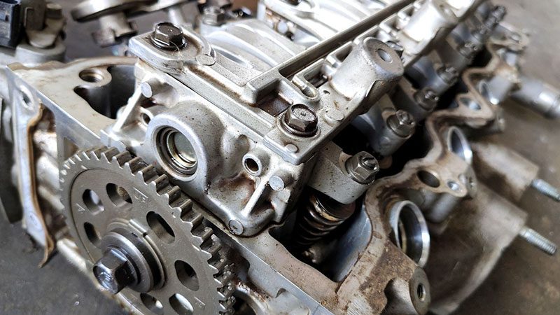 Close-up of an old car engine awaiting disassembly and rebuild