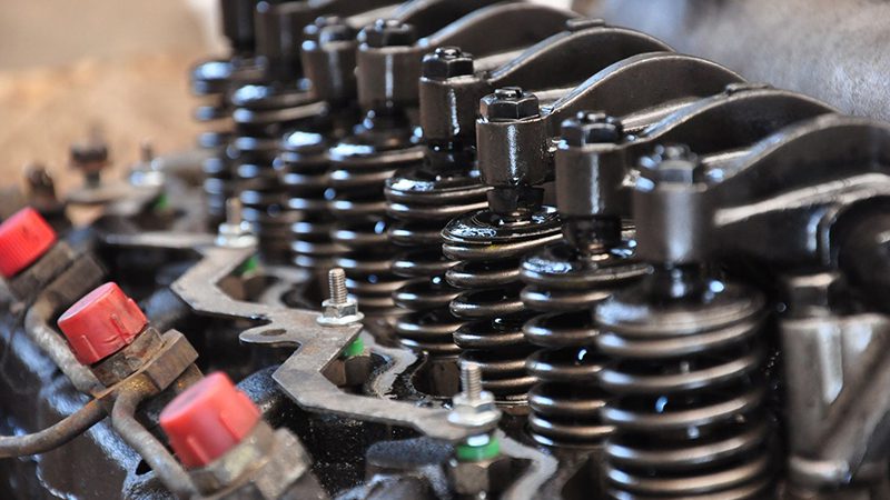 Close-up of diesel engine valves showing detailed structure and placement within the cylinder head, highlighting their function in heavy-duty engines.