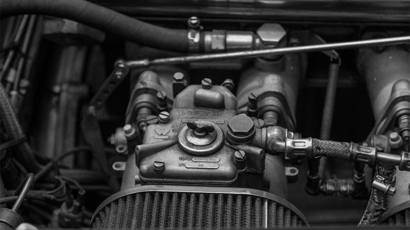 Close-up photo of automobile engine cylinders showcasing internal combustion components.