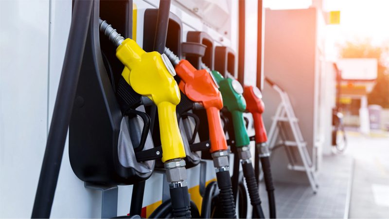 A gas station with fueling pumps, where drivers refill their vehicles with gasoline.