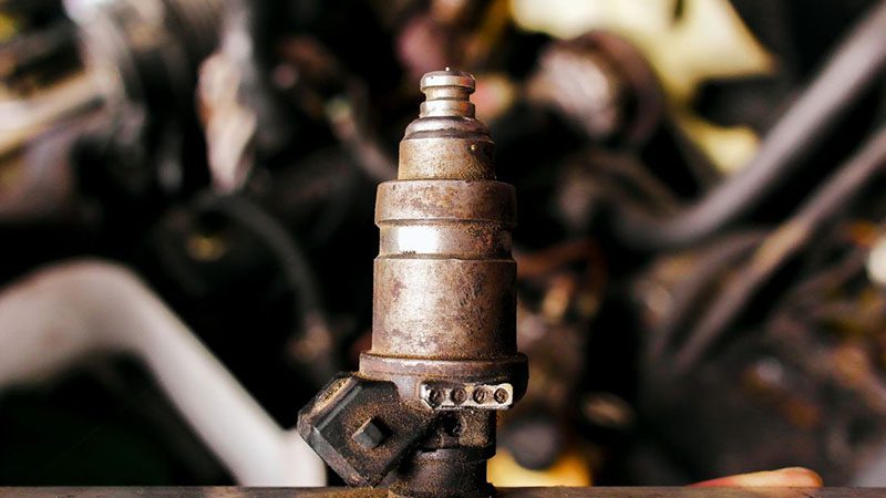 Close-up of old, broken gas injectors from an LPG fuel system in a car