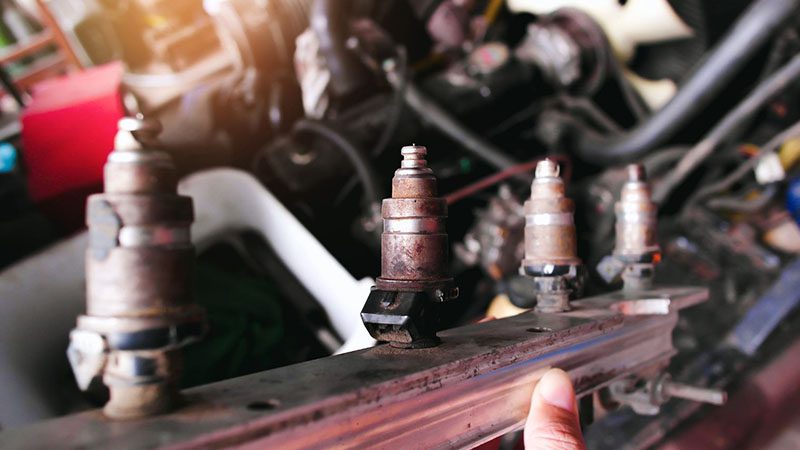 Close-up of old, broken gas injectors from an LPG (Liquefied Petroleum Gas) alternative fuel system in a car