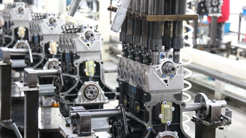 Engine manufacturing line in Nanjing Woda Auto Technology Co., Ltd.'s factory, showcasing the production process of automotive engine parts.