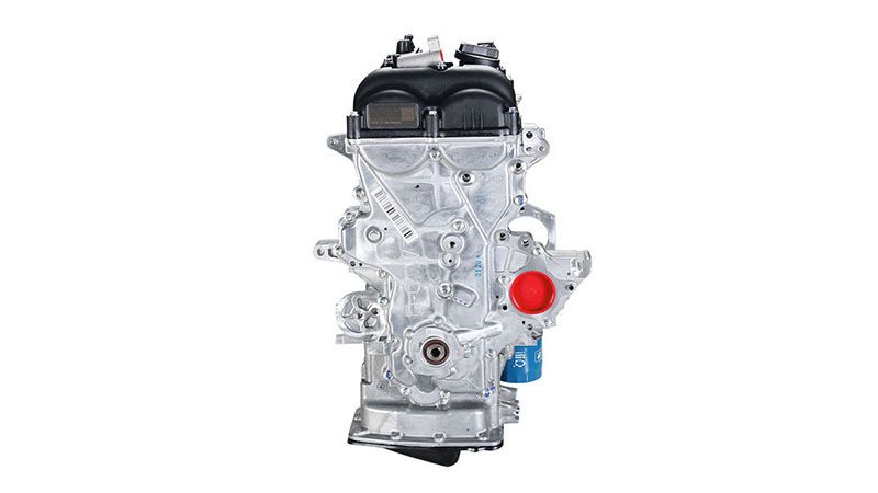 Side view of a G4FD engine, highlighting the timing cover, pulleys, and accessory components.