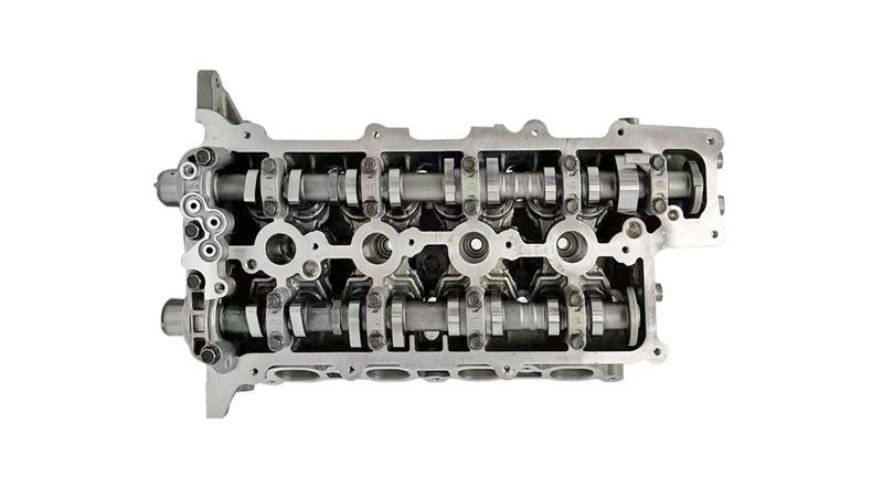 Close-up of G4FJ 1.6T cylinder head showing valve springs, camshaft housing, and combustion chamber ports.