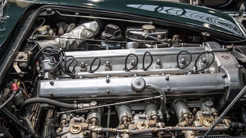 Close-up of a car engine, focusing on the intake manifold and its detailed design to optimize engine airflow and performance.