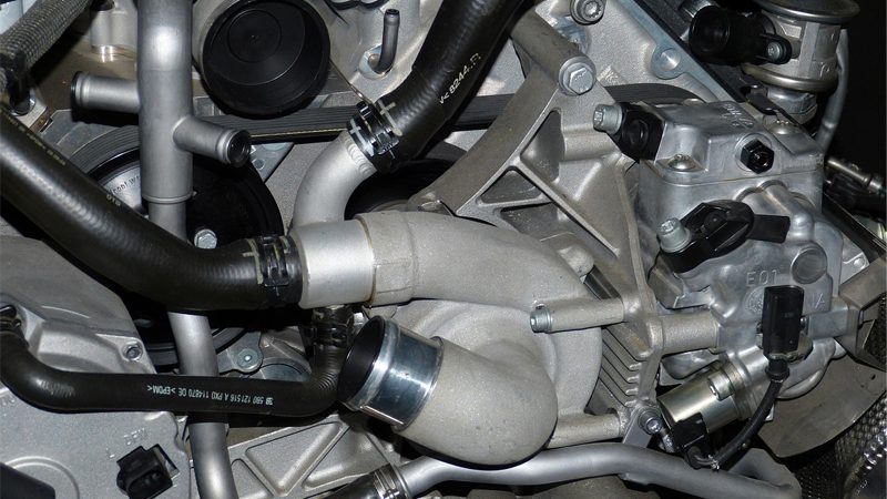 A close-up view of a car's intake manifold, highlighting its complex design and precision construction for optimal engine performance.