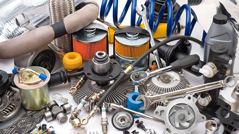 A large assortment of auto parts arranged in a workshop.