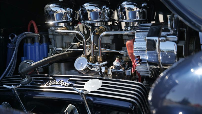 A car engine gleaming in the sun.