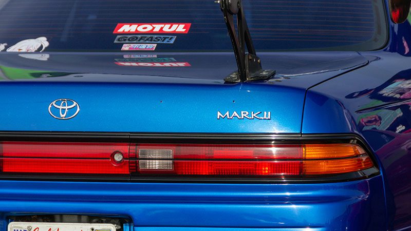 The back of a blue Toyota.