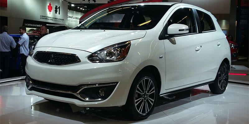 Close-up view of a Mitsubishi Mirage, highlighting the car's exterior design and features.