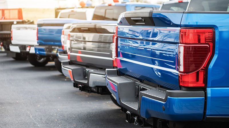 Close-up of different pickup trucks – Encouraging test drives of the most fuel-efficient trucks to find the best option for performance and savings.