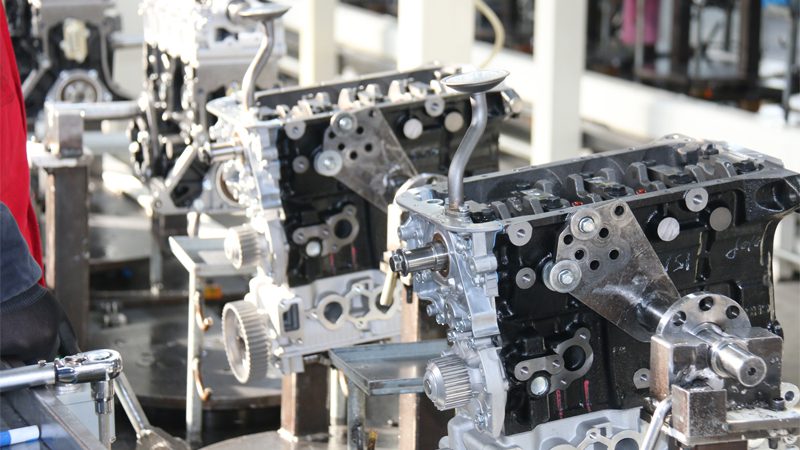 Close-up of an engine production line at Nanjing Woda Auto Technology Co., Ltd. – Showcasing the high-quality engine components we produce for optimal performance and efficiency.