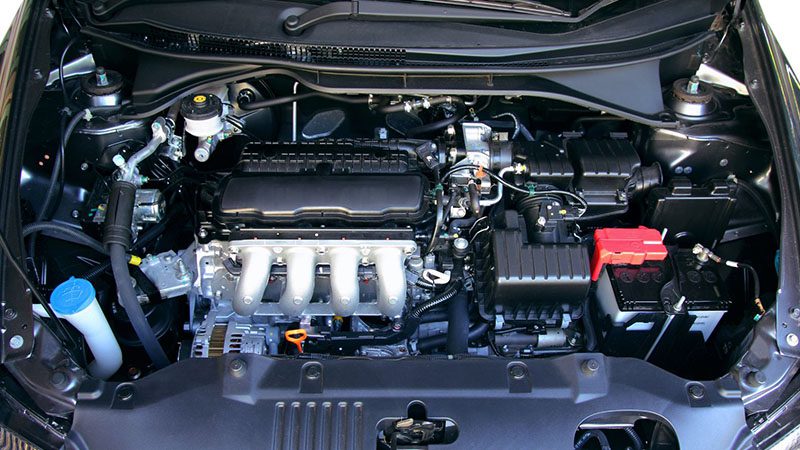 Engine compartment of a new car, showing components under the hood of a modern automobile.