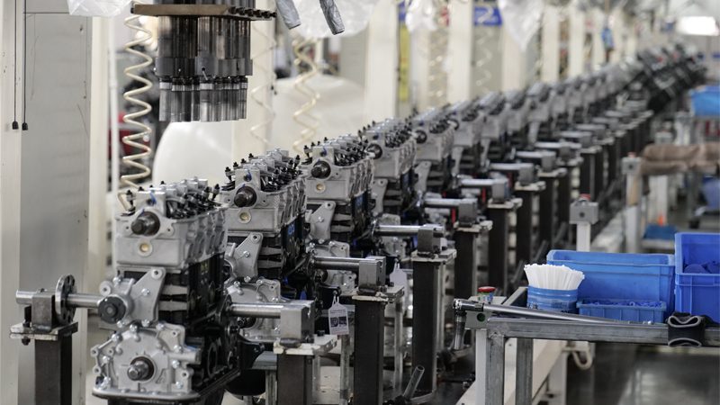 Engine production line at the factory of Nanjing Woda Auto Technology Co., Ltd., showcasing advanced manufacturing of high-quality engine components.
