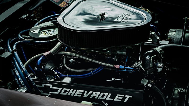 Detailed close-up of a Chevrolet LS engine showcasing performance parts and intricate mechanics.