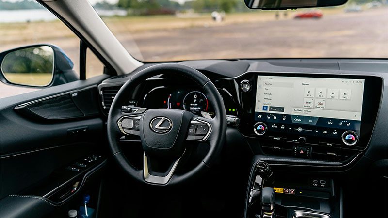 Detailed view of a Lexus ES car interior featuring a modern touchscreen and steering controls.