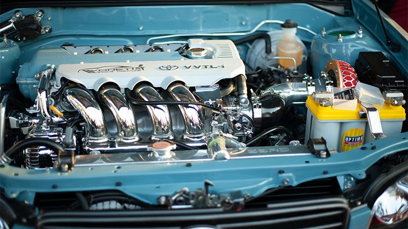 Detailed view of a shiny and powerful Toyota engine, showcasing automotive engineering