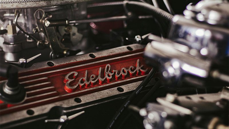 Detailed close-up of an Edelbrock 3.5 liter engine component, showcasing high-performance automotive parts.