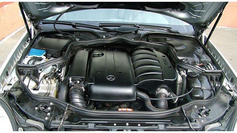 Close up of a clean engine compartment of a gray Mercedes Benz