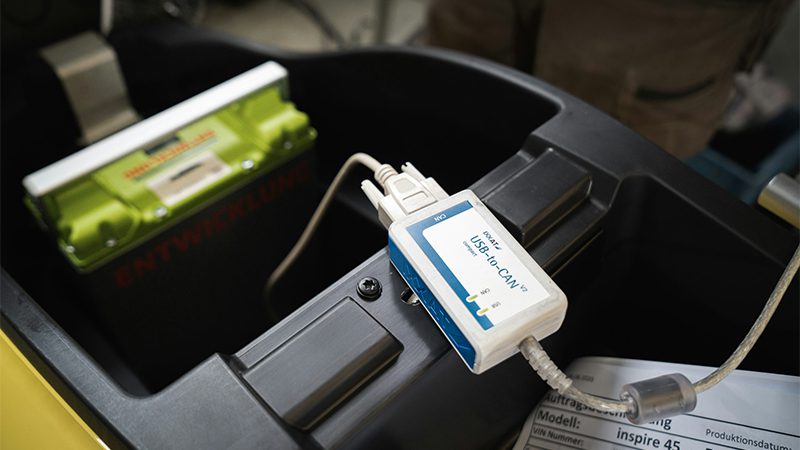 Using an OBD-II scanner to check for Diagnostic Trouble Codes (DTC) in a car's engine system.