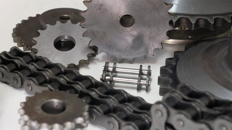 Close-up view of car engine parts, including components like the crankshaft and camshaft.