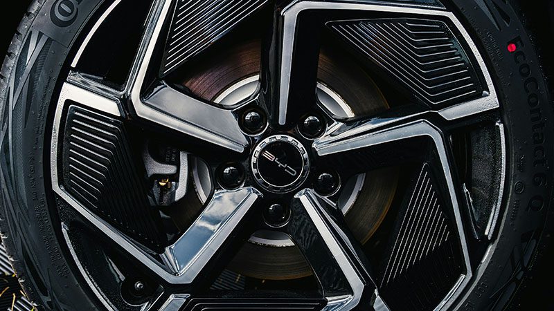 Close-up of a BYD car wheel featuring the BYD logo and modern rim design.