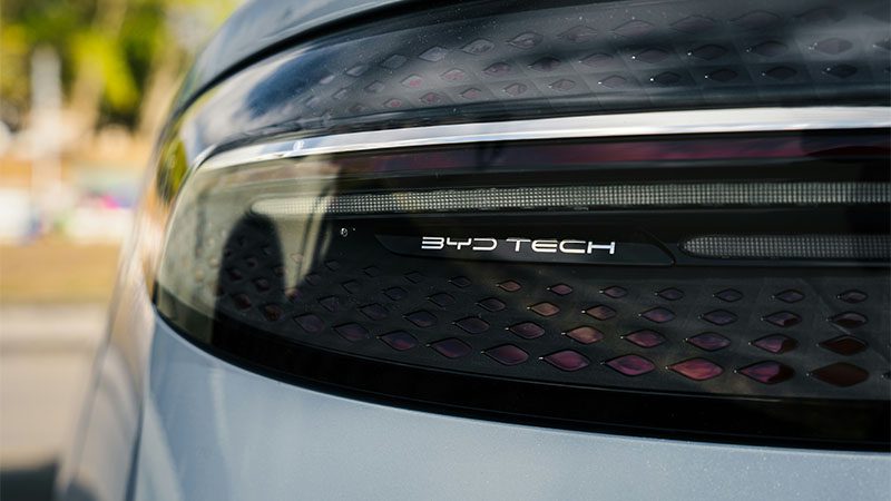 Rear view of a BYD car displaying the 'BYD Tech' branding on the back.