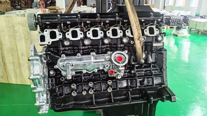 Front view of a Toyota 1HZ bare diesel engine with visible components.