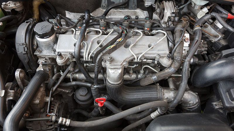 Close-up view of a car engine showing detailed components and parts.