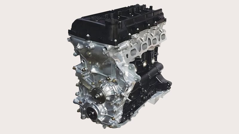 Close-up view of a Toyota 2TR engine showing cylinder head and intake manifold details