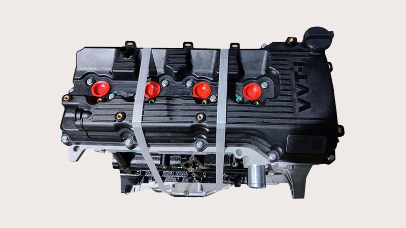 Upward view of a Toyota 2TR engine highlighting engine block and component layout