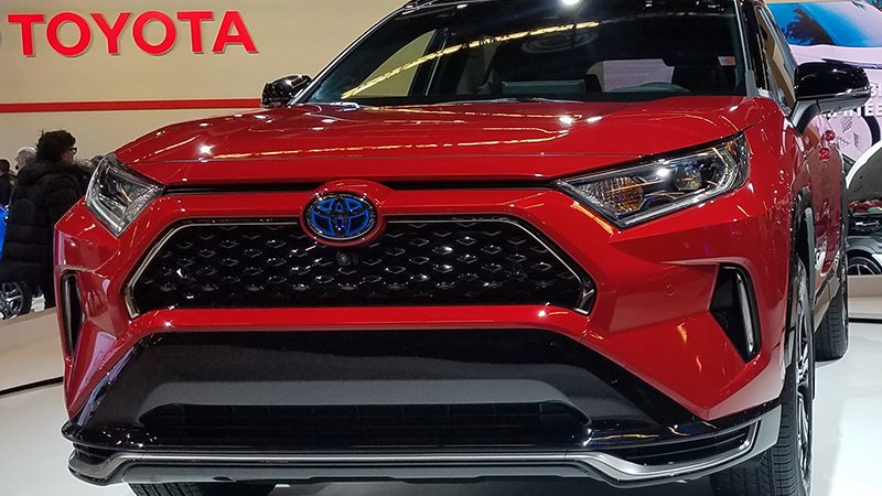 Close-up view of the Toyota RAV4 Prime, highlighting its rugged design and plug-in hybrid capabilities.
