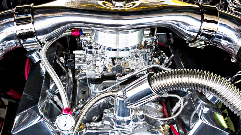 Close-up of a high-performance engine, highlighting components used in advanced oiling systems like dry sump setups.