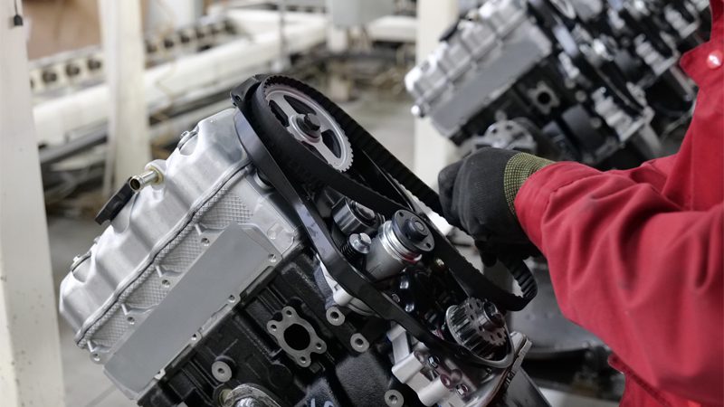 Close-up of an engine being assembled on the production line at Nanjing Woda Auto Technology Co., Ltd.'s factory.
